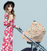 Couverture d'allaitement polyvalente 4-en-1 Mom Boss d'Itzy Ritzy, motif floral.